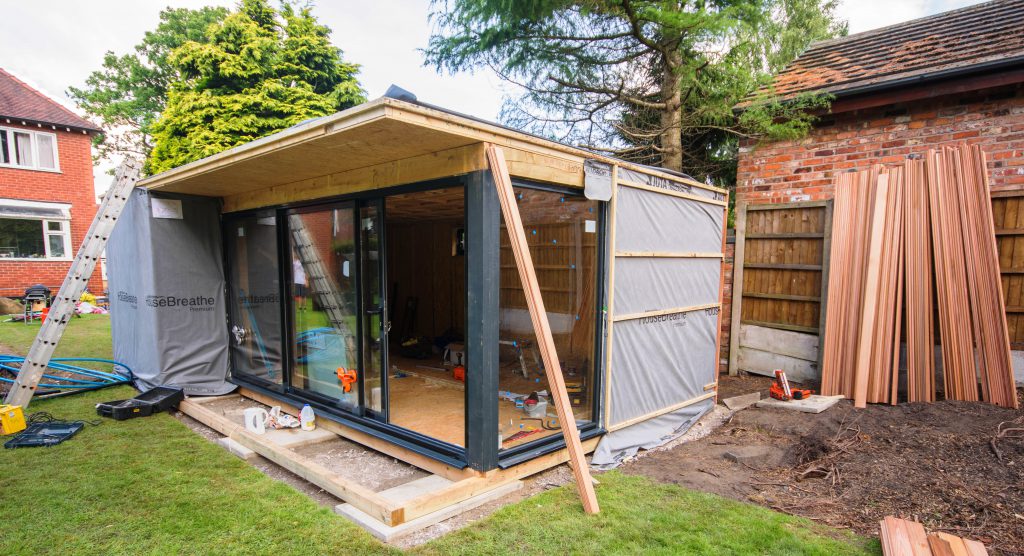 garden annexe installation team at work