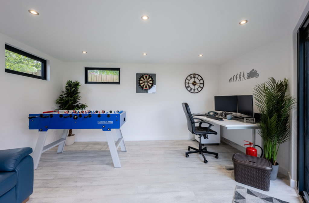 man cave interior with games and desk